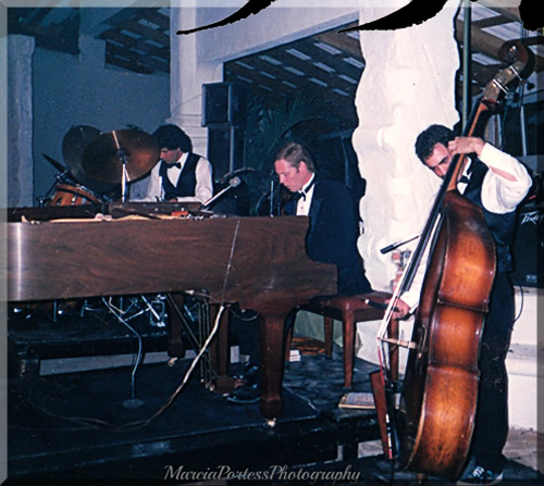 Photo of the Jerry Michelsen Trio performing on stage in tuxedos
