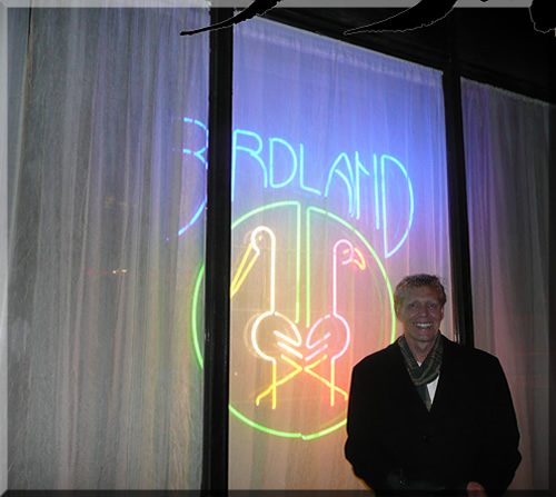 Photo of Jerry Michelsen in New York City standing in front of the neon sign at the famous jazz club Birdland